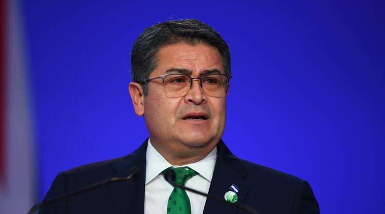 FILE - Honduras' President Juan Orlando Hernandez speaks during the opening ceremony of the UN Climate Change Conference COP26 in Glasgow, Scotland, Monday Nov. 1, 2021. (Andy Buchanan/Pool via AP, File)
