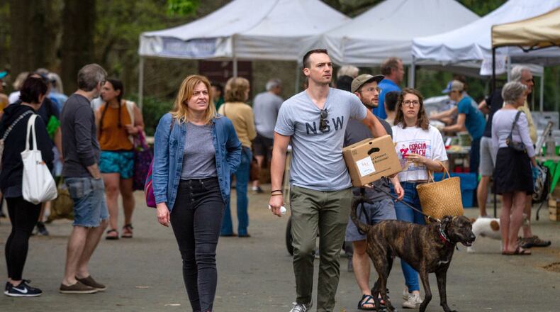 Shoppers walk through the Carter Center Farmers Market Saturday, March 28, 2020. STEVE SCHAEFER / SPECIAL TO THE AJC