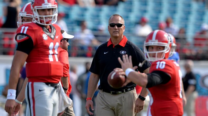 Georgia head coach Mark Richt watches quarterback Faton Bauta throw before the game against Florida in 2015 in Jacksonville, Fla. This was Richt’s final season as the Bulldogs’ head coach.