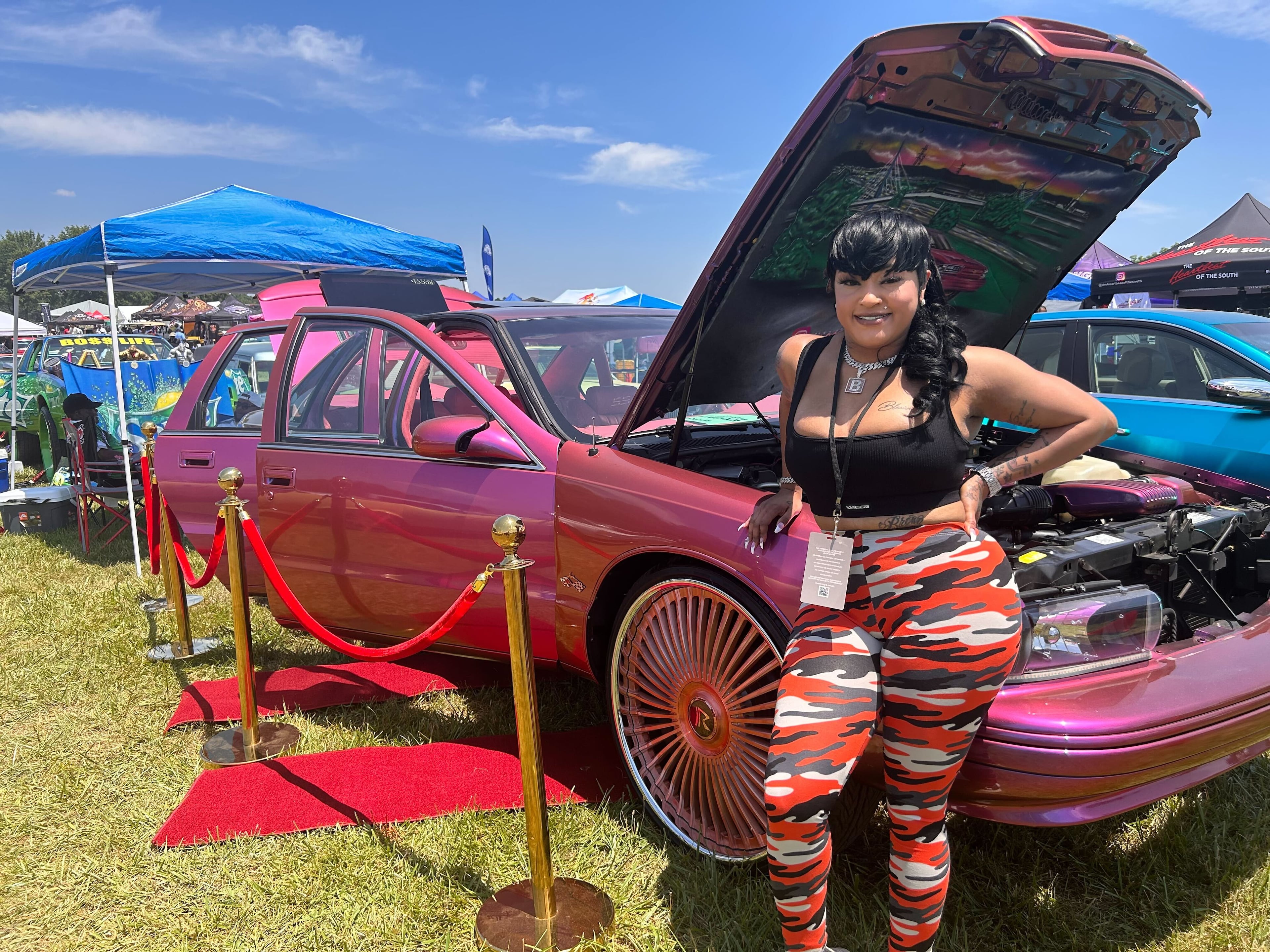 Kendra Fletcher's bright pink Impala was hard to miss at the Rick Ross car and bike show in 2023. (Caroline Silva/AJC)