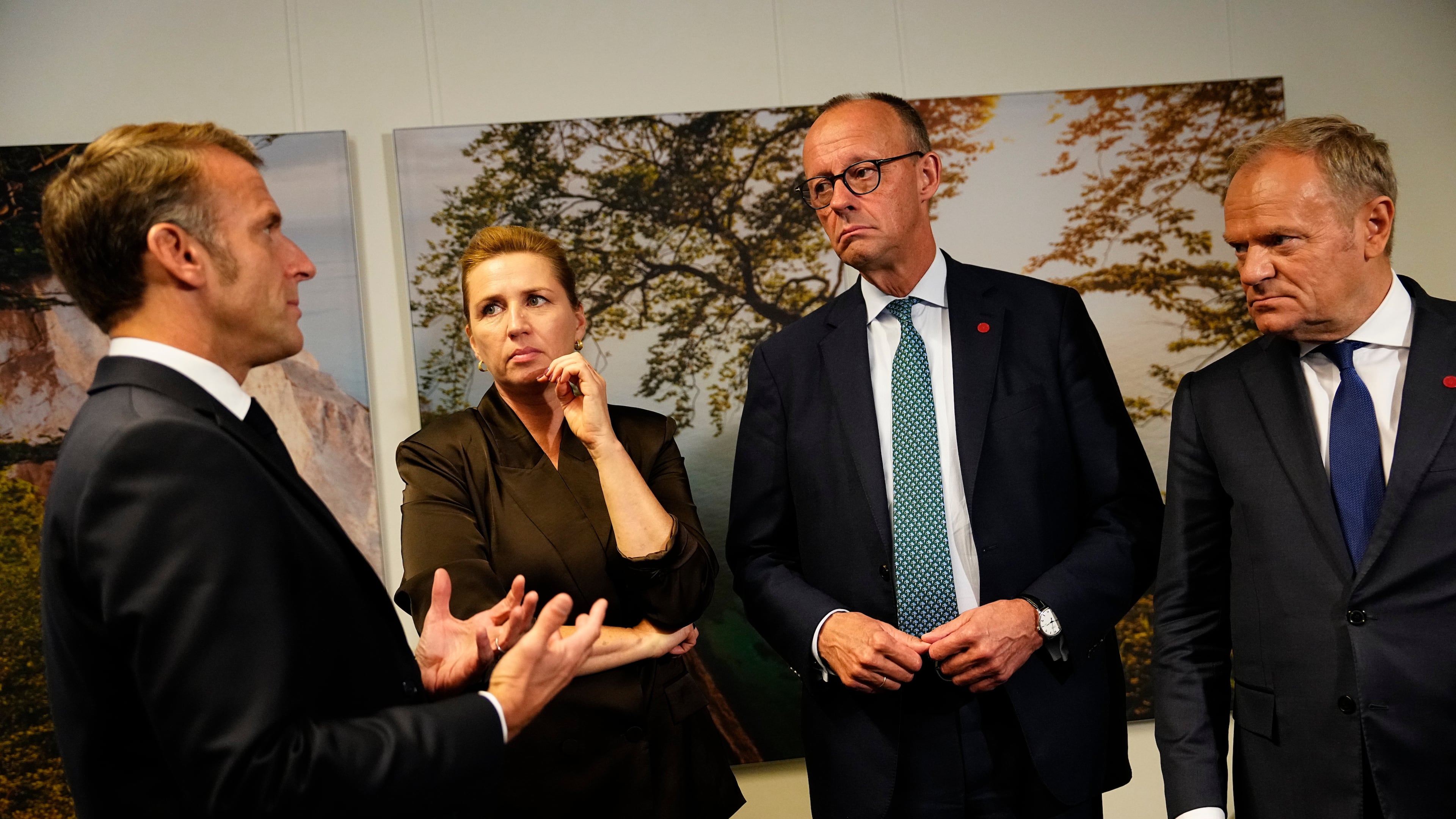 From left, France's President Emmanuel Macron, Danish Prime Minister Mette Frederiksen, German Chancellor Friedrich Merz and Poland's Prime Minister Donald Tusk talk during a meeting of the European Political Community (EPC) in Copenhagen, Denmark, Thursday, Oct. 2, 2025. (Mads Claus Rasmussen/Ritzau Scanpix via AP)