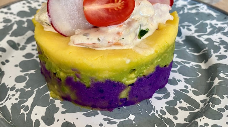 At a recent pop-up dinner at Silver Queen restaurant in Monroe, La Chingana chef Arnaldo Castillo served this Peruvian causa, layered with purple potato, avocado, white potato and shrimp salad.
Wendell Brock for The Atlanta Journal-Constitution