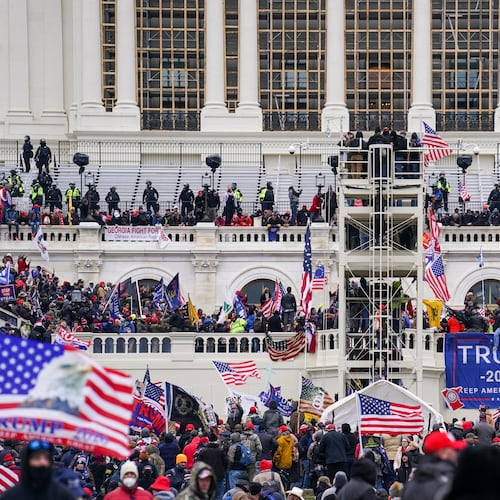 FILE - Insurrectionists loyal to President Donald Trump breach the Capitol in Washington, Jan. 6, 2021. (AP Photo/John Minchillo, File)