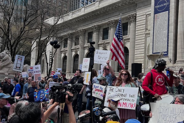 People gather to protest President Donald Trump's policies on Saturday, April 19, 2025 in New York. (AP Photo/Joseph Frederick)