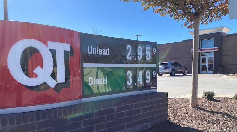 Gas prices have edged up in recent days, but they are nowhere near the highs of 2022. Here, a QT station displays gas prices on Nov. 21 in Alpharetta. (Michael E. Kanell/AJC)