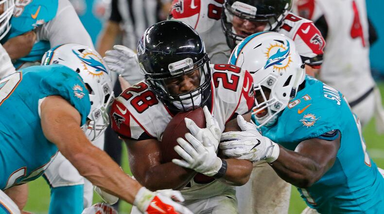 Terron Ward of the Atlanta Falcons is brought down by Joby Saint Fleur of the Miami Dolphins, right during their preseason game at Hard Rock Stadium on August 10, 2017 in Miami Gardens, Florida. (Photo by Joe Skipper/Getty Images)