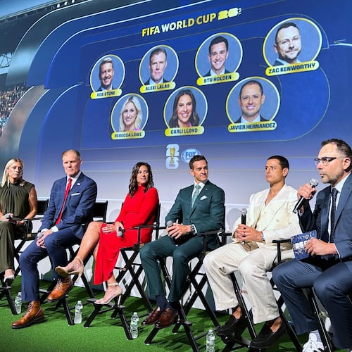 Fox Sports hosts, from left, Rob Stone and Rebecca Lowe, and former player/analysts Alexi Lalas, Stu Holden and Javier Hernandez listen as Fox Sports' vice president of production Zac Kenworthy speaks during a World Cup soccer new conference, Thursday, May 21, 2026, in New York. (AP Photo/Ronald Blum)