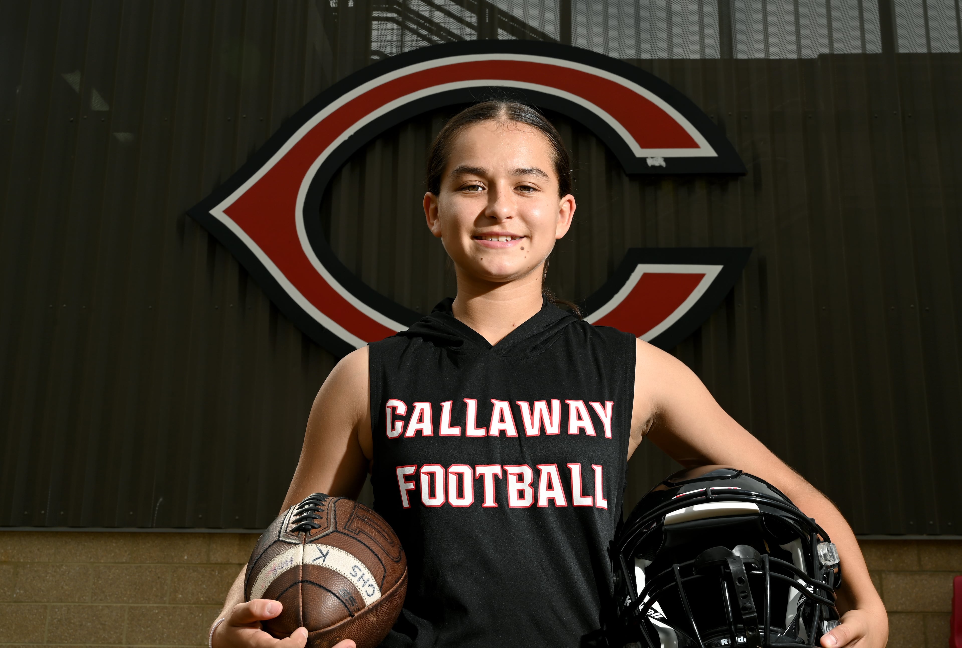Callaway High's Mia Flores, who is the first female football player in the school’s football history, poses for a portrait at Callaway High School, Thursday, September 25, 2025, in Hogansville. (Hyosub Shin / AJC)