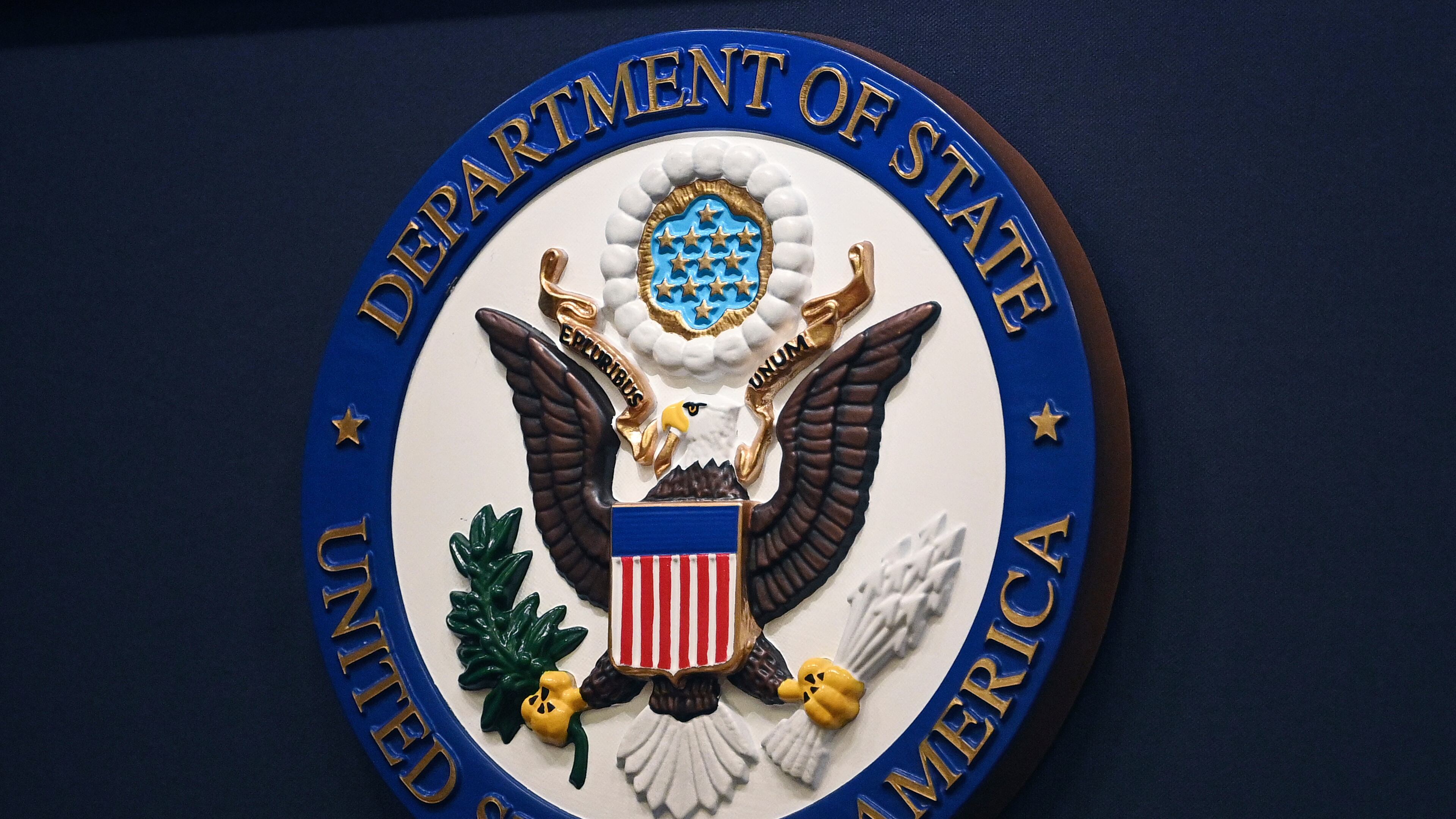 FILE - The State Department seal is seen on the briefing room lectern at the State Department in Washington, Jan. 31, 2022. (Mandel Ngan, Pool via AP, File)