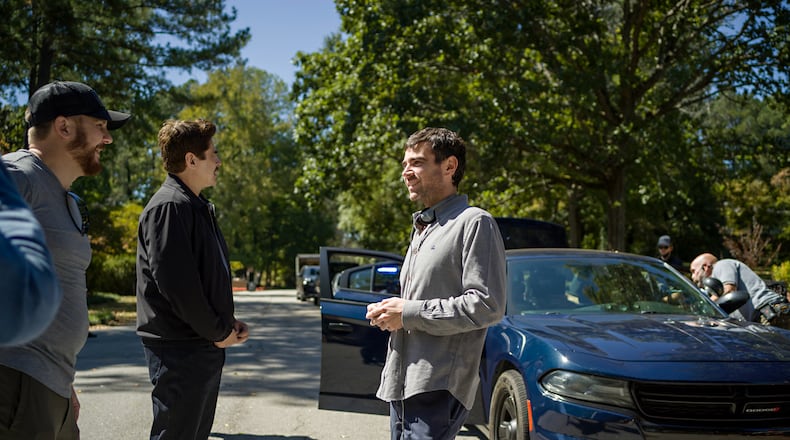 (Featured L-R) Benicio del Toro and director Grant Singer on the set of "Reptile" in metro Atlanta. Cr. Kyle Kaplan/Netflix © 2023