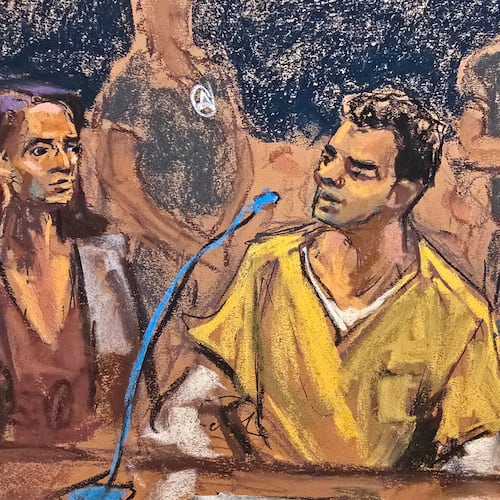 In this courtroom sketch, Luigi Mangione, center, sits between his attorneys, Karen Friedman Agnifilo, left, and Marc Agnifilo, right, before pleading guilty to federal stalking charges in the killing of UnitedHealthcare CEO Brian Thompson, Friday, Aug. 14, 2026, in New York. (Jane Rosenberg via AP)