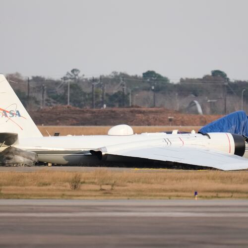 A NASA aircraft sits near a runway at Ellington Airport after making a belly landing on Tuesday, Jan. 27, 2026, in Houston. (AP Photo/Ashley Landis)