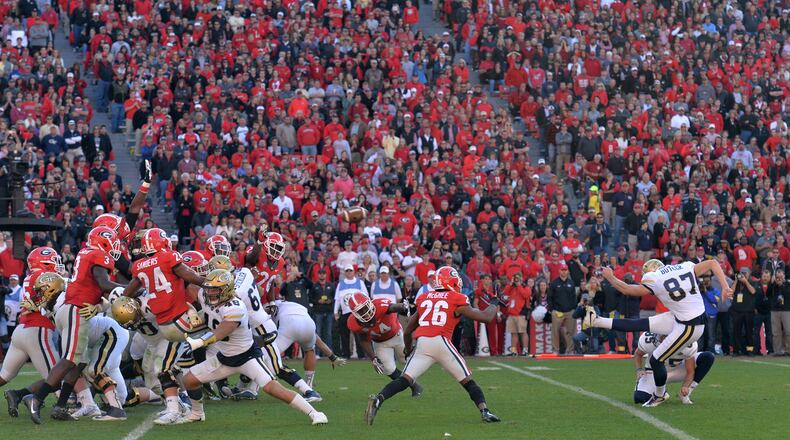 Georgia Tech place kicker Harrison Butker (87) scores an extra point to win 28-27 over the Georgia at Sanford Stadium on Saturday, Nov. 26, 2016. Georgia Tech won 28-27 over Georgia. HYOSUB SHIN / HSHIN@AJC.COM