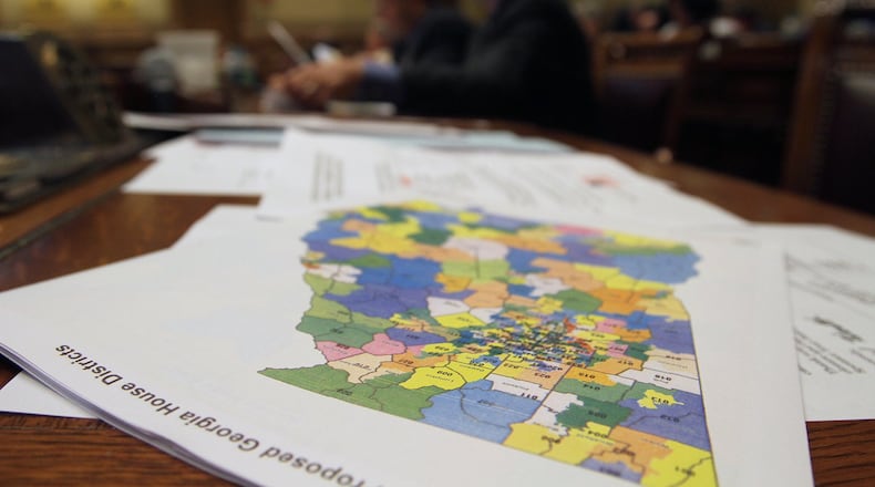 A Georgia map lays on a table in a courtroom. 2016 census data shows Fulton County’s population is larger than that of 76 countries.