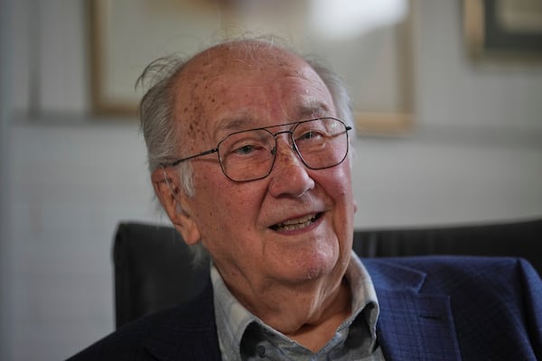 John Goldsmith, 94, draws during an interview at his home in London, Thursday, April 24, 2025. (AP Photo/Kin Cheung)