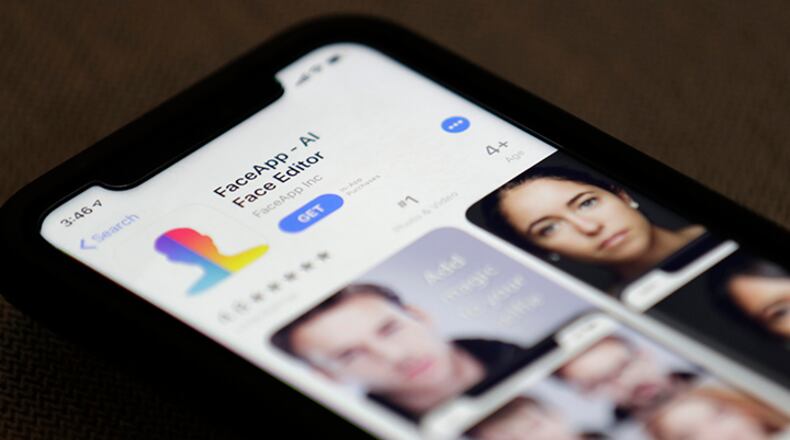FaceApp is displayed on an iPhone. The popular mobile app is under fire for privacy concerns.