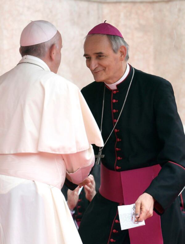 FILE - Pope Francis, left, speaks to Archbishop Matteo Maria Zuppi during his visit to Bologna, Italy, Oct. 1, 2017. (L'Osservatore Romano/Pool photo via AP, file)