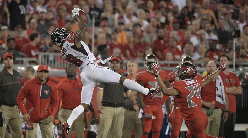 Atlanta Falcons wide receiver Taylor Gabriel (18) makes a catch in front of Tampa Bay Buccaneers cornerback Brent Grimes (24) during the third quarter of an NFL football game Thursday, Nov. 3, 2016, in Tampa, Fla. (AP Photo/Phelan Ebenhack)