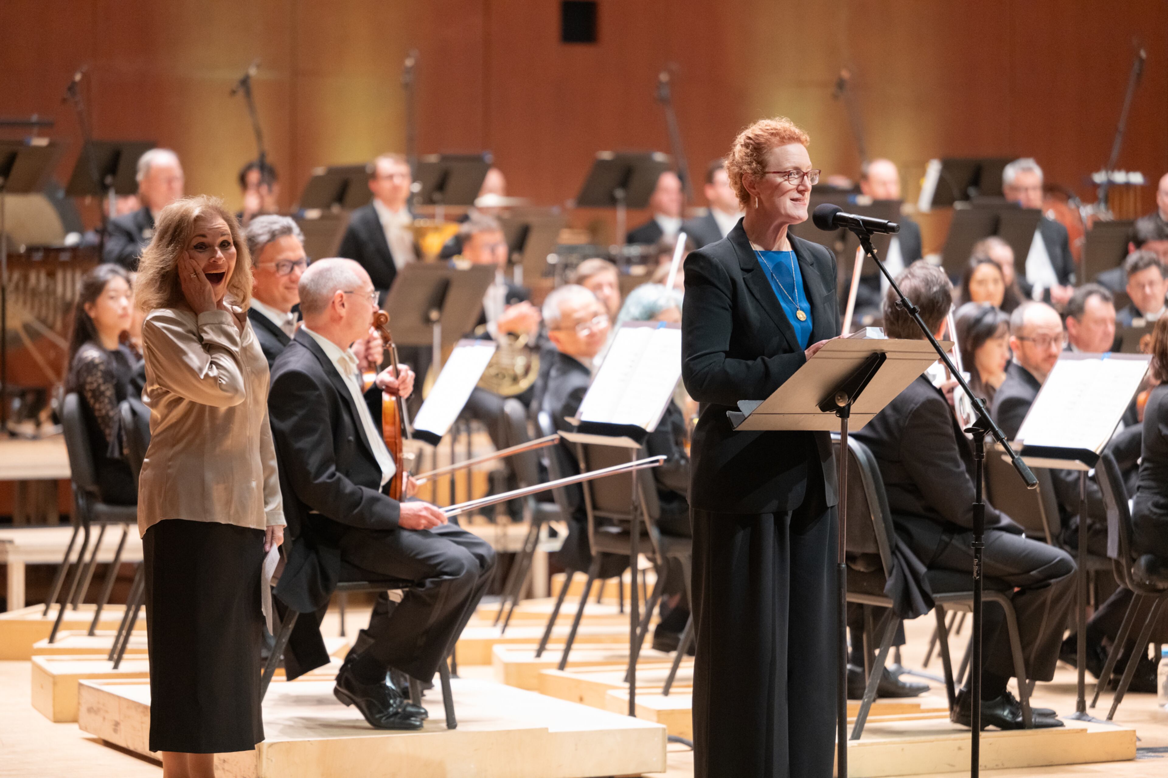Atlanta Symphony Orchestra executive director Jennifer Barlament rewards Lois Reitzes a lifetime "Golden Ticket" free pass for any ASO concert for the rest of her life on May 29, 2025 in advance of her retirement from WABE after 46 years. ASO