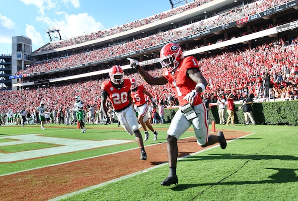 USC transfer Zachariah Branch (right) made his Georgia debut at receiver on Saturday, Aug. 30, 2025, with a team-leading three catches for 95 yards and a touchdown. (Hyosub Shin/AJC)