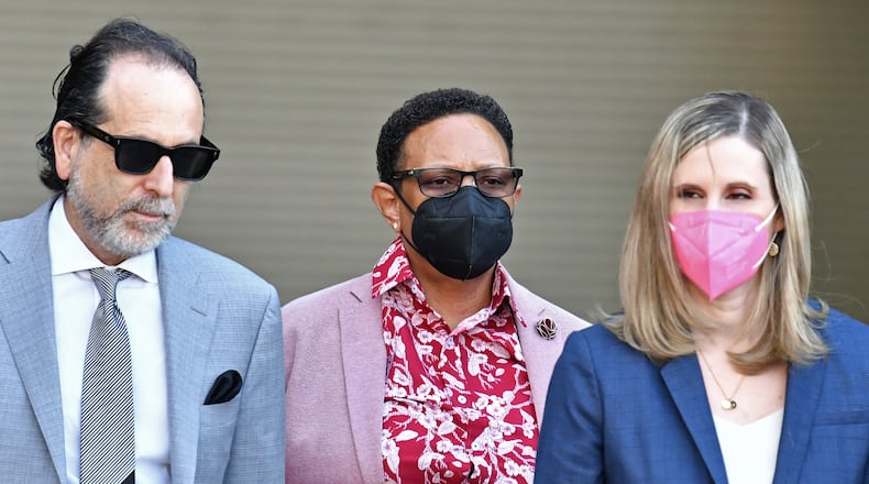 Mitzi Bickers, center, who served as former Mayor Kasim Reed’s director of human services, leaves with her attorneys, Drew Findling, left, and Marissa Goldberg after her hearing in federal court at the Richard B. Russell Federal Building on Thursday, March 3, 2022. Bickers is set to be the first person to face a jury in the Atlanta City Hall corruption investigation. She faces 12 counts related to an alleged conspiracy involving pay-to-play contracting. (Hyosub Shin / Hyosub.Shin@ajc.com)