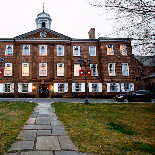 FILE - Lights glow in Rutgers University's Old Queens building, April 4, 2013, in New Brunswick, N.J. (AP Photo/Mel Evans, File)