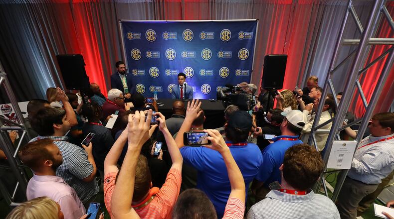 Alabama Crimson Tide quarterback Bryce Young is surrounded by news media asking questions during his press conference at SEC Media Days in the College Football Hall of Fame on Tuesday, July 19, 2022, in Atlanta.   “Curtis Compton / Curtis Compton@ajc.com”