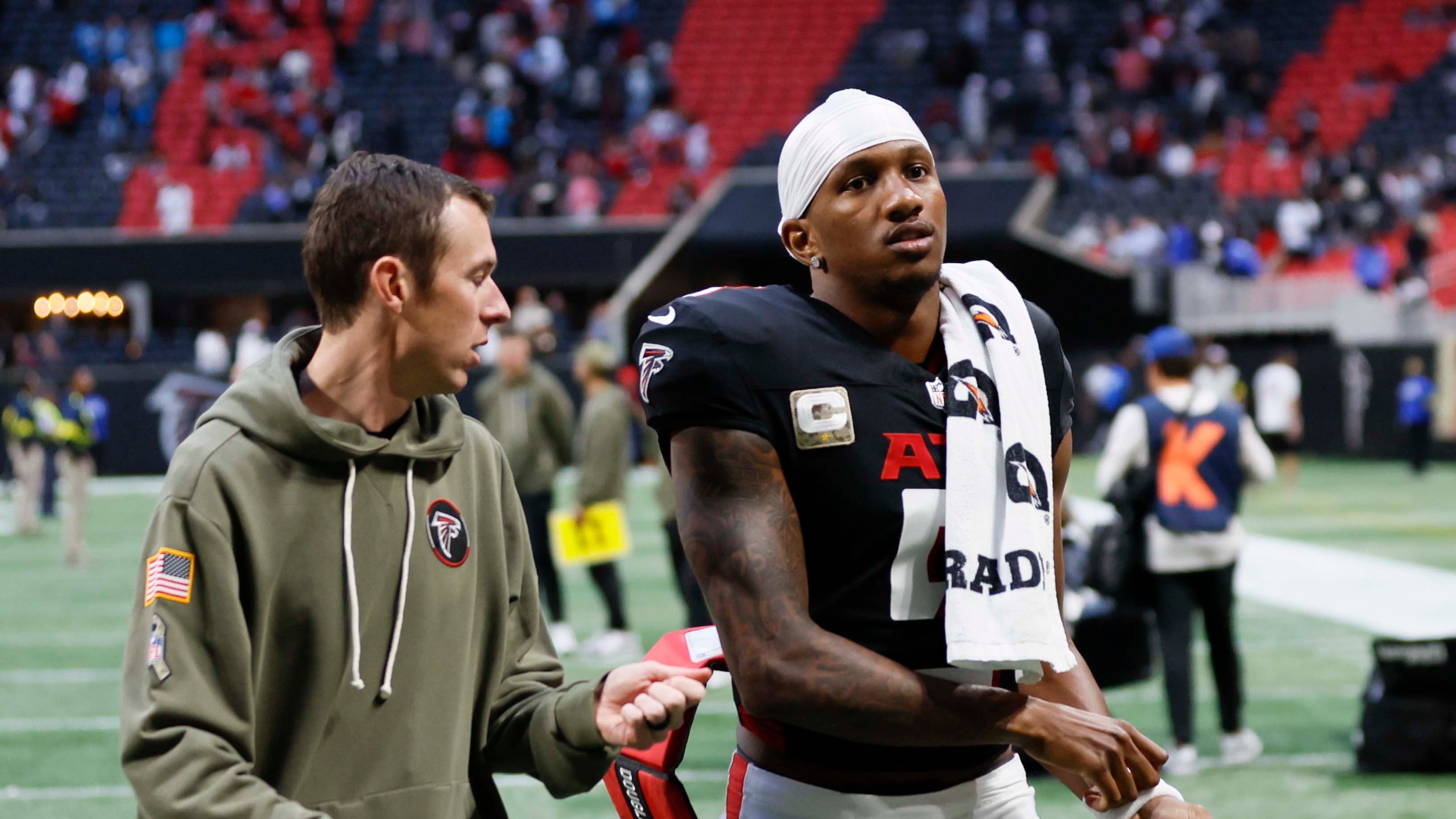 Atlanta Falcons quarterback Michael Penix Jr. leaves the field after the game Sunday, when the Carolina Panthers won in overtime 30-27. (Miguel Martinez/AJC)