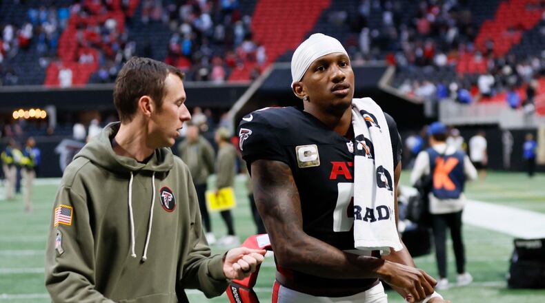Atlanta Falcons quarterback Michael Penix Jr. leaves the field after the game Sunday, when the Carolina Panthers won in overtime 30-27. (Miguel Martinez/AJC)
