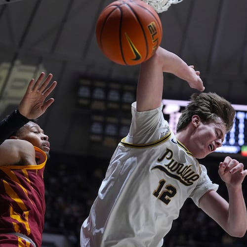 Purdue center Daniel Jacobsen (12) looses the ball after being fouled by Iowa State forward Joshua Jefferson (5) during the second half of an NCAA college basketball game in West Lafayette, Ind., Saturday, Dec. 6, 2025. (AP Photo/Michael Conroy)