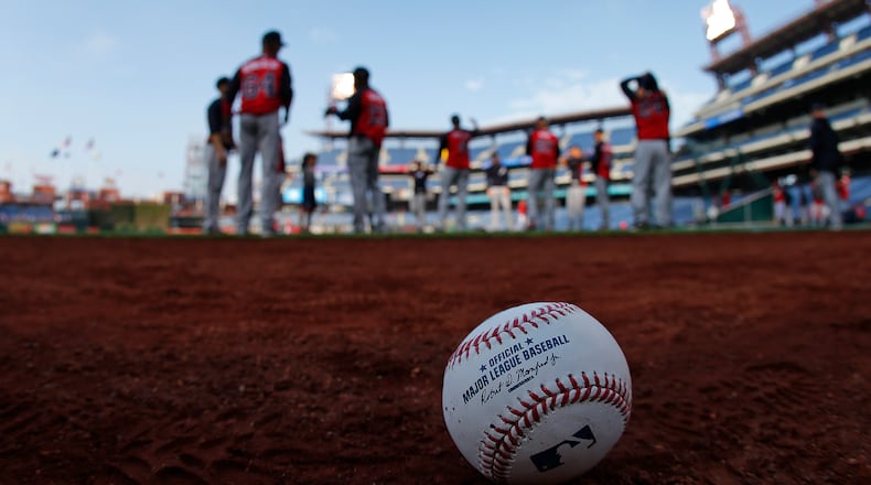 The Atlanta Braves warm up before a game against the Philadelphia Phillies April 21, 2017, at Citizens Bank Park in Philadelphia.