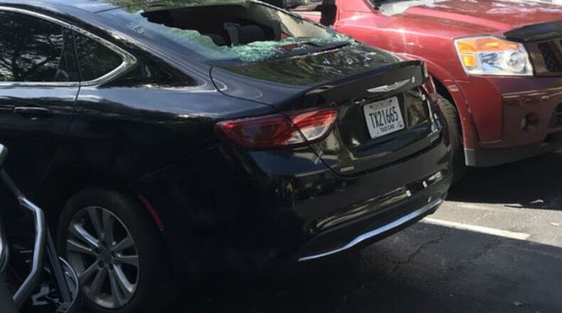People in this taxicab were victims of a shooting early Sunday outside a restaurant in Brookhaven.
