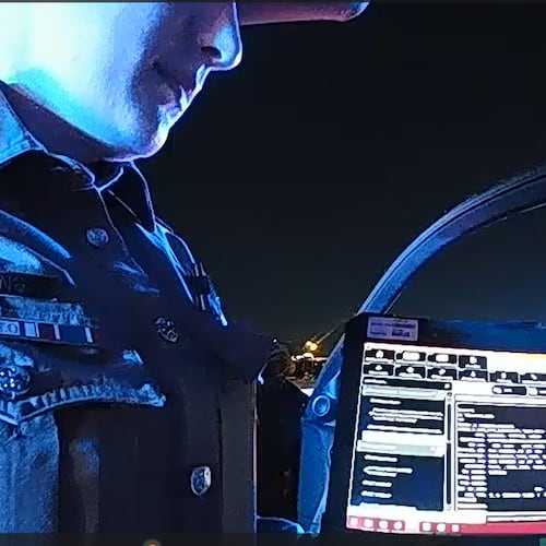 This image taken from video provided by Texas Department of Public Safety shows bodycam footage of law enforcement looking up information about Cowboys defensive end Marshawn Kneeland while searching for him, Nov. 5, 2025, in Frisco, Texas. (Texas Department of Public Safety via AP)