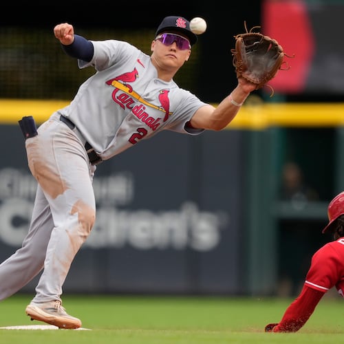Cincinnati Reds Elly De La Cruz, right, steals second base as St. Louis Cardinals second baseman JJ Wetherholt, left, takes the throw during the eighth inning of a baseball game, Thursday, Aug. 20, 2026, in Cincinnati. (AP Photo/Carolyn Kaster)