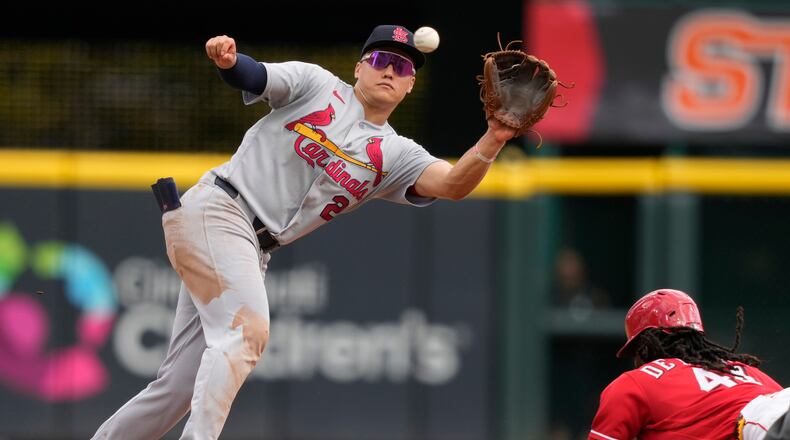 Cincinnati Reds Elly De La Cruz, right, steals second base as St. Louis Cardinals second baseman JJ Wetherholt, left, takes the throw during the eighth inning of a baseball game, Thursday, Aug. 20, 2026, in Cincinnati. (AP Photo/Carolyn Kaster)