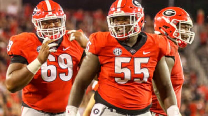 Weight loss has been an offseason priority for Georgia offensive linemen Jamaree Salyer (69) and Trey Hill.