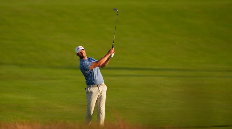 Wyndham Clark hits from the fairway on the third hole during the first round of the U.S. Open golf tournament at Shinnecock Hills Golf Club in Southampton, N.Y., Thursday, June 18, 2026.(AP Photo/David J. Phillip)