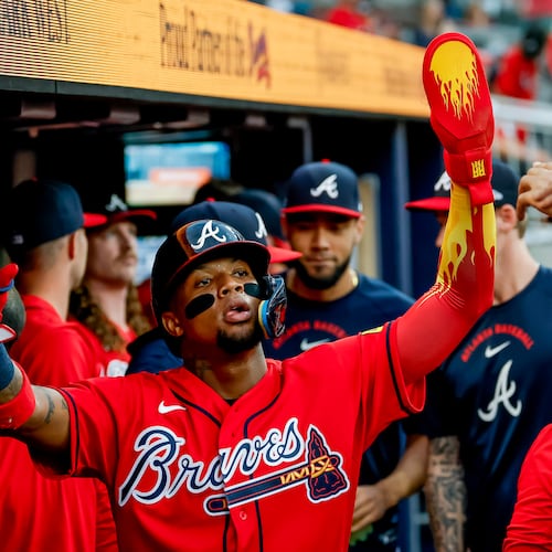 Atlanta Braves' Ronald Acuña Jr., center, is greeted in the dugout after scoring against the Colorado Rockies during the second inning of a baseball game, Friday, Aug. 28, 2026, in Atlanta. (Erik S. Lesser/AP)