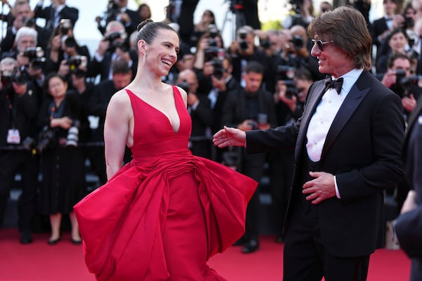Hayley Atwell, left, and Tom Cruise pose for photographers upon arrival at the premiere of the film 'Mission: Impossible - The Final Reckoning' at the 78th international film festival, Cannes, southern France, Wednesday, May 14, 2025. (Photo by Scott A Garfitt/Invision/AP)