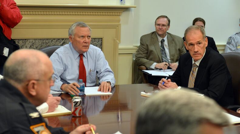 Gov. Nathan Deal. left, and Georgia Emergency Management Director Charley English before the start a Emergency Operations Command committee meeting Tuesday February 11, 2014. BRANT SANDERLIN /BSANDERLIN@AJC.COM