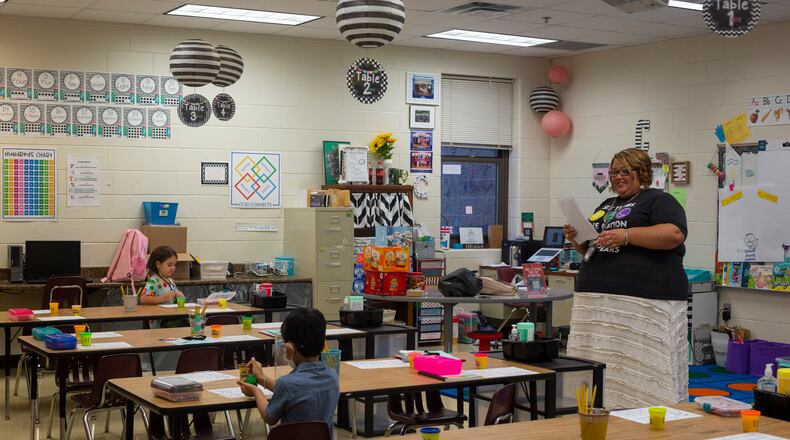 Kindergarten teacher Rebecca Coleman greets her new students on the first day of school at Clark Creek Elementary School in Acworth, Georgia, on August 2, 2021. New Georgia enrollment counts show growth in kindergarten enrollment statewide after declines last year.  (Rebecca Wright for the Atlanta Journal-Constitution)