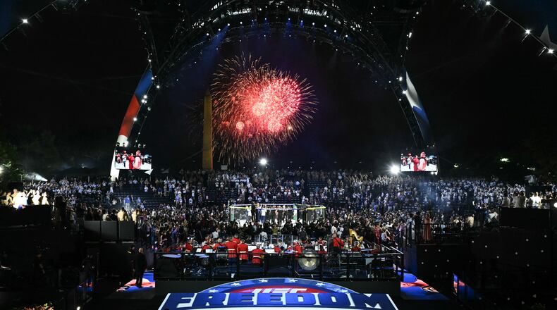 Fireworks go off as Justin Gaethje celebrates after defeating Ilia Topuria in a lightweight title bout during UFC Freedom 250 on the South Lawn of the White House, Monday, June 15, 2026, in Washington. (Saul Loeb/Pool Photo via AP)