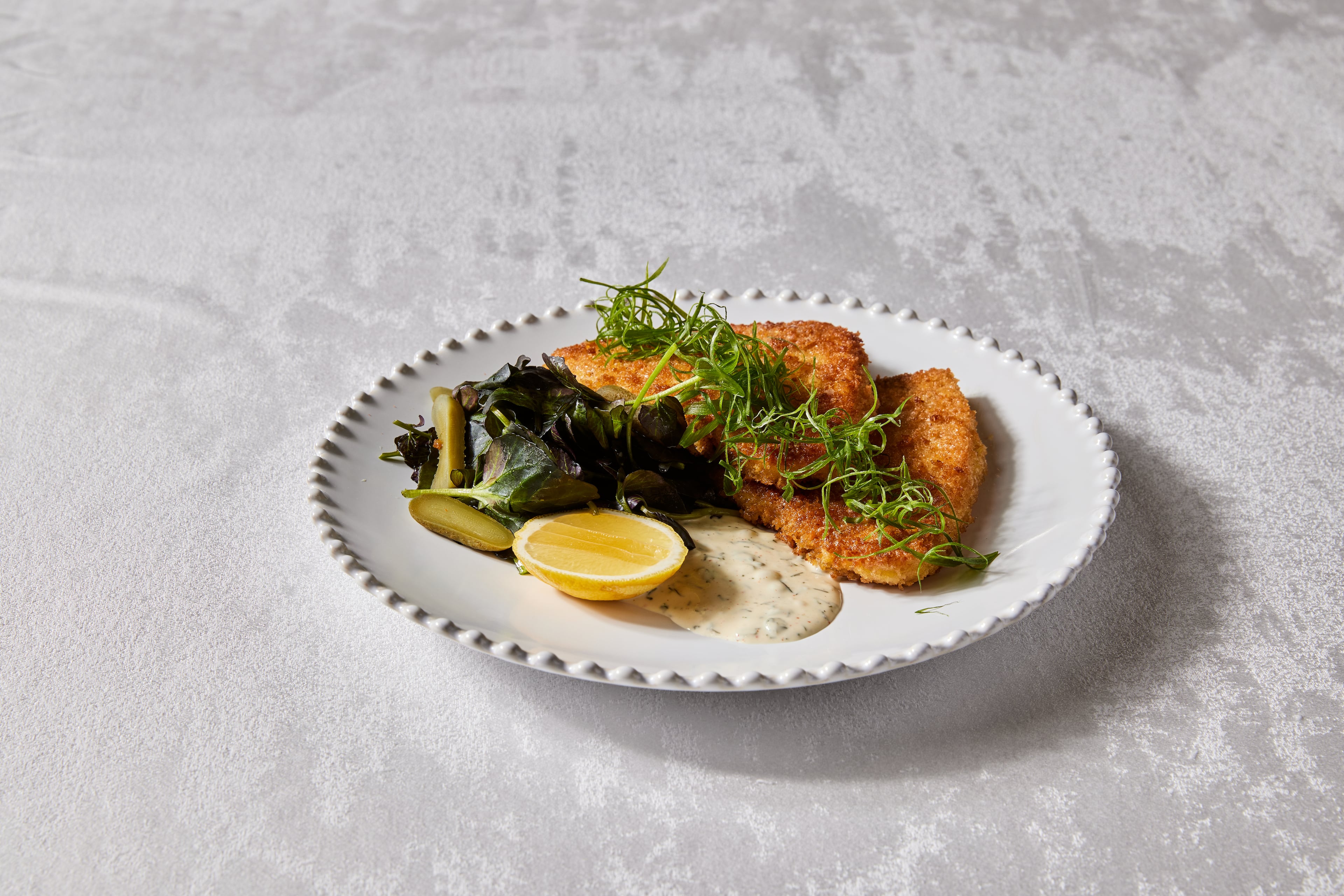The French-inspired menu at Brasserie Margot at the Four Seasons Hotel Atlanta features Swordfish Milanese. (Courtesy of Kathryn McCrary)