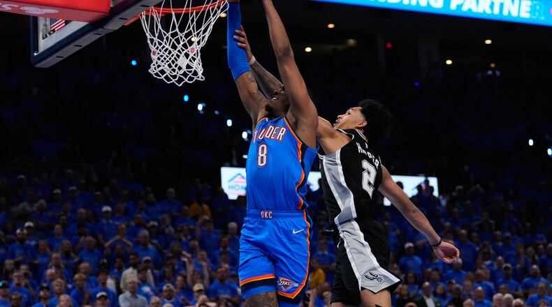 Oklahoma City Thunder guard Jalen Williams (8) shoots against San Antonio Spurs guard Dylan Harper (2) during overtime of Game 1 in a third-round NBA basketball playoffs series Monday, May 18, 2026, in Oklahoma City. (AP Photo/Tony Gutierrez)