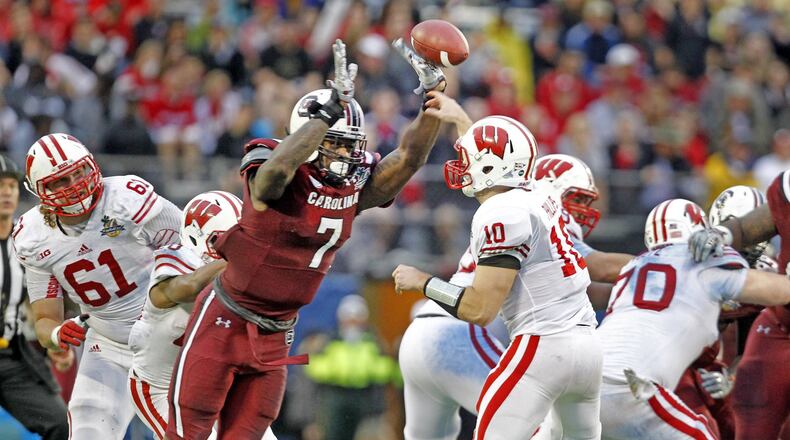 South Carolina defensive end Jadeveon Clowney (7) tips a pass attempt by Wisconsin quarterback Curt Phillips (10) in the fourth quarter in the Capital One Bowl on Wednesday, Jan. 1, 2014, in Orlando. South Carolina won, 34-24. (Gerry Melendez/The State/MCT) Jadeveon Clowney could be a difference maker for Falcons. Gerry Melendez/The State
