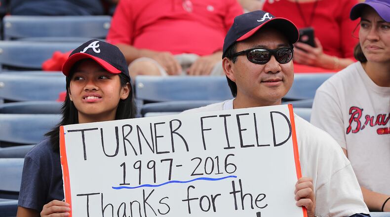 October 02, 2016 Atlanta: Jeff Kwan and his daughter Josie, Powder Springs, are on hand for the Braves final game at Turner Field on Sunday, Oct. 2, 2016, in Atlanta. The team will move to a new stadium in Cobb County for the 2017 season. Curtis Compton /ccompton@ajc.com