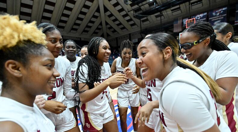 Hebron Christian players celebrate their win over Wesleyan during GHSA Basketball Class 3A Girl’s State Championship game at the Macon Centreplex, Friday, Mar. 8, 2024, in Macon. Hebron Christian won 62-60 over Wesleyan. (Hyosub Shin / Hyosub.Shin@ajc.com)