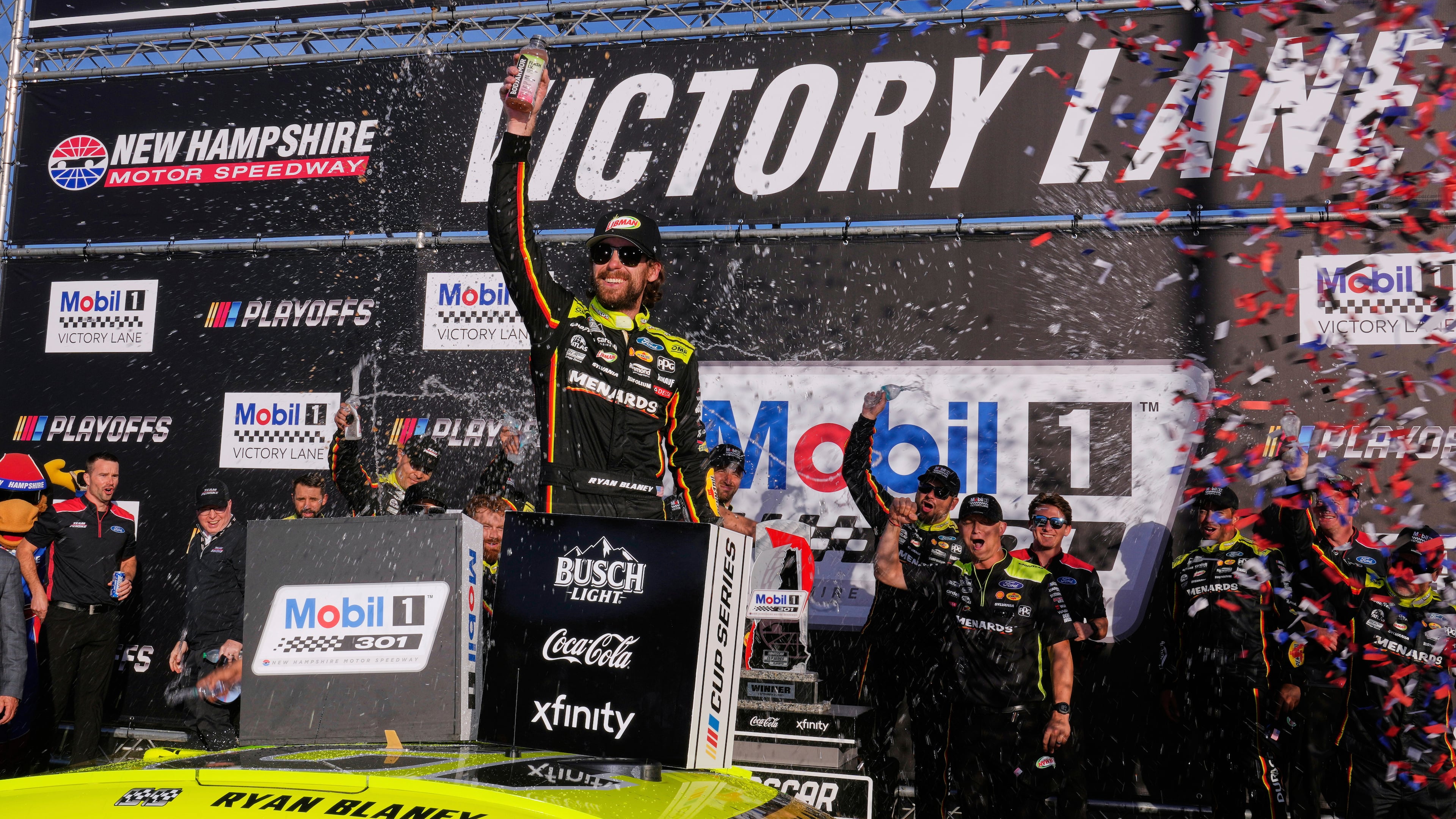 Ryan Blaney, center, celebrates in Victory Lane after winning a NASCAR Cup Series race at New Hampshire Motor Speedway, Sunday, Sept. 21, 2025, in Loudon, N.H. (AP Photo/Charles Krupa)