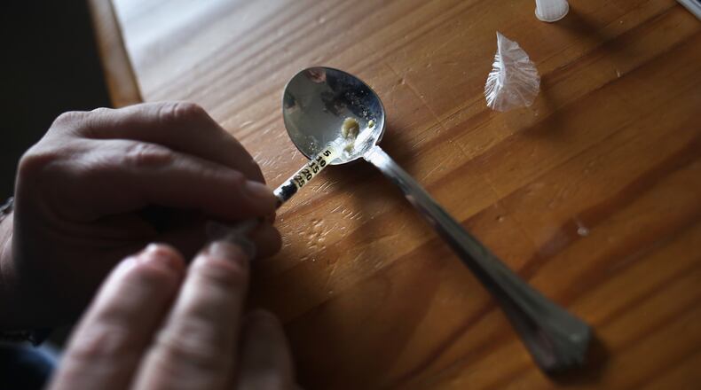 A heroin user prepares to inject himself in New London, CT. Communities nationwide are struggling with the unprecidented heroin and opioid pain pill epidemic.