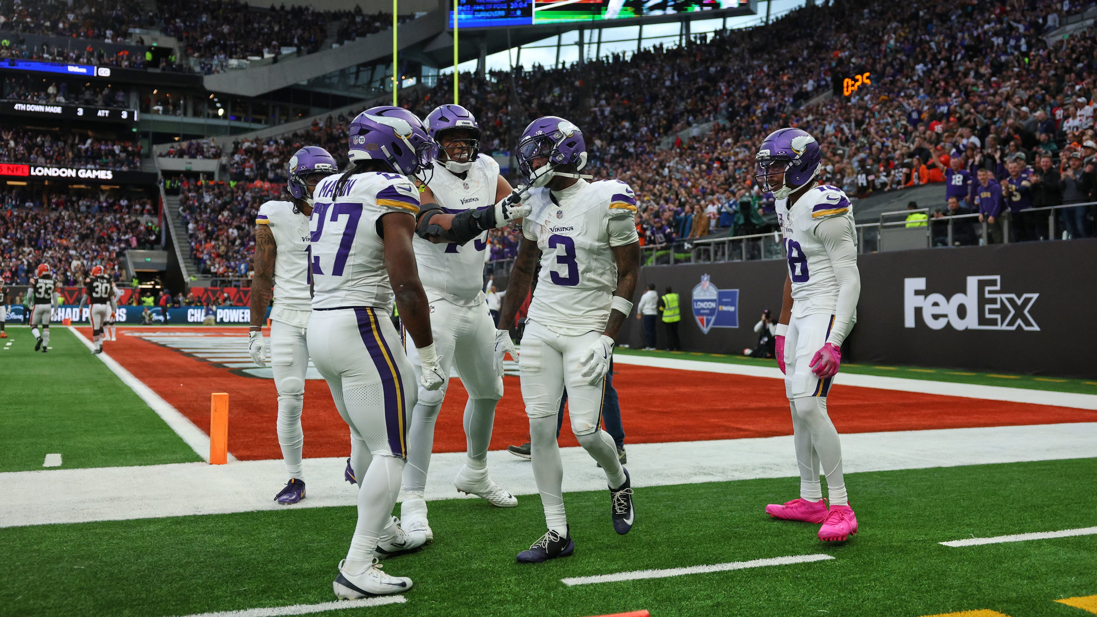 Minnesota Vikings wide receiver Jordan Addison (3) celebrates with his teammates after scoring a touchdown during the second half of the NFL game between Minnesota Vikings and Cleveland Browns at the Tottenham Hotspur stadium in London, Sunday, Oct. 5, 2025. (AP Photo/Ian Walton)